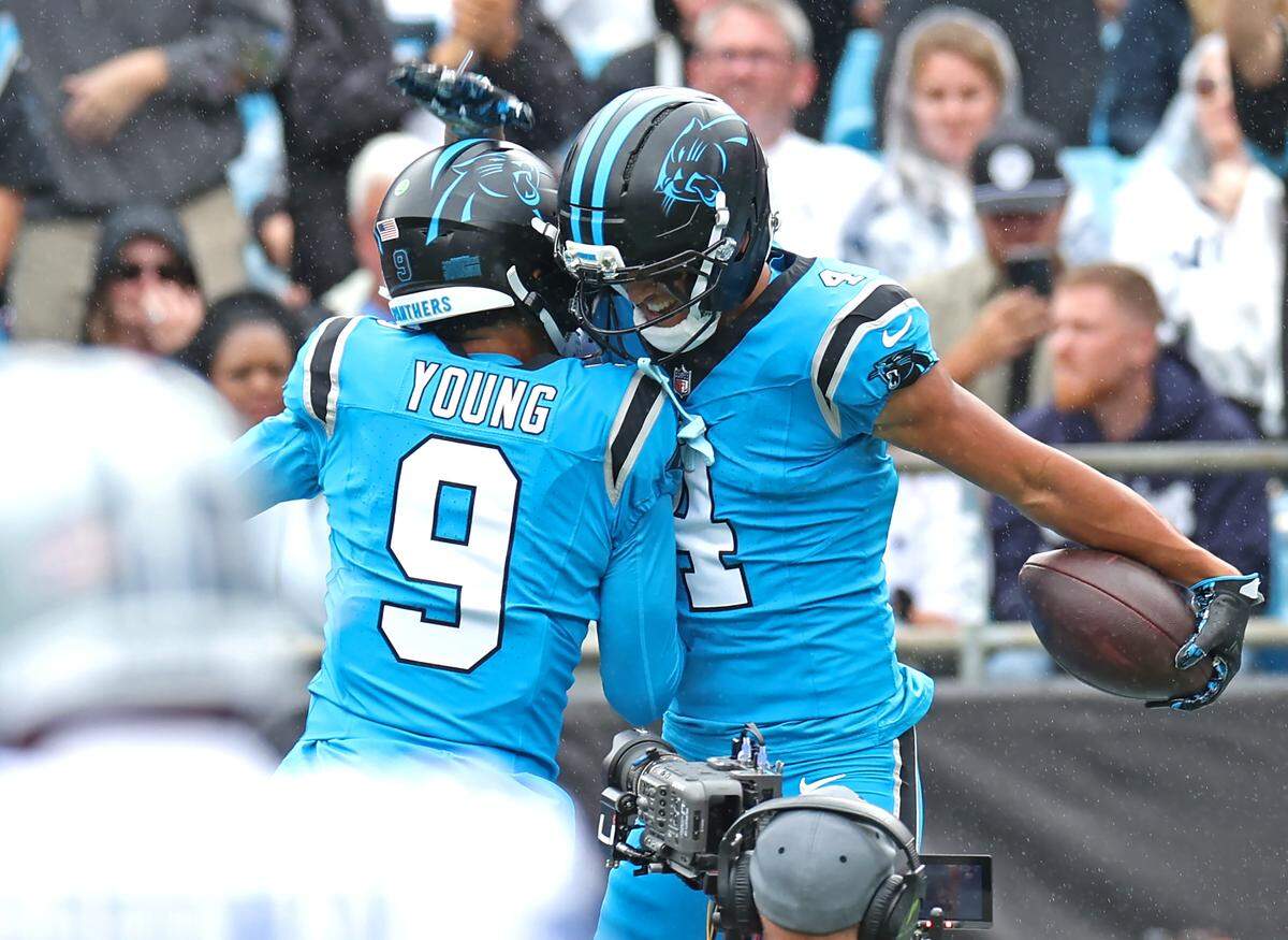 Carolina Panthers quarterback Bryce Young, left, and wide receiver Tetairoa McMillan celebrate McMillan’s touchdown pass reception during action against the Dallas Cowboys on Sunday, October 12, 2025 at Bank of America Stadium.