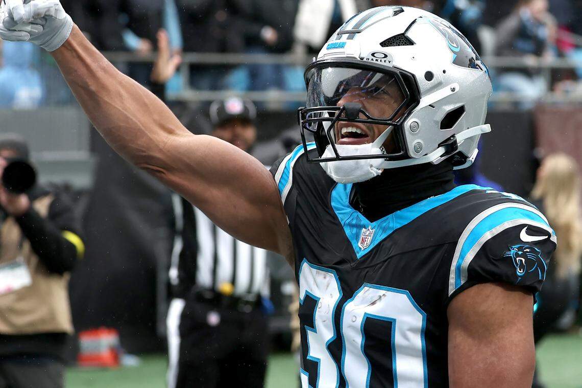Carolina Panthers running back Chuba Hubbard celebrates his rushing touchdown against the Los Angeles Rams during action at Bank of America Stadium in Charlotte, NC on Sunday, November 30, 2025.