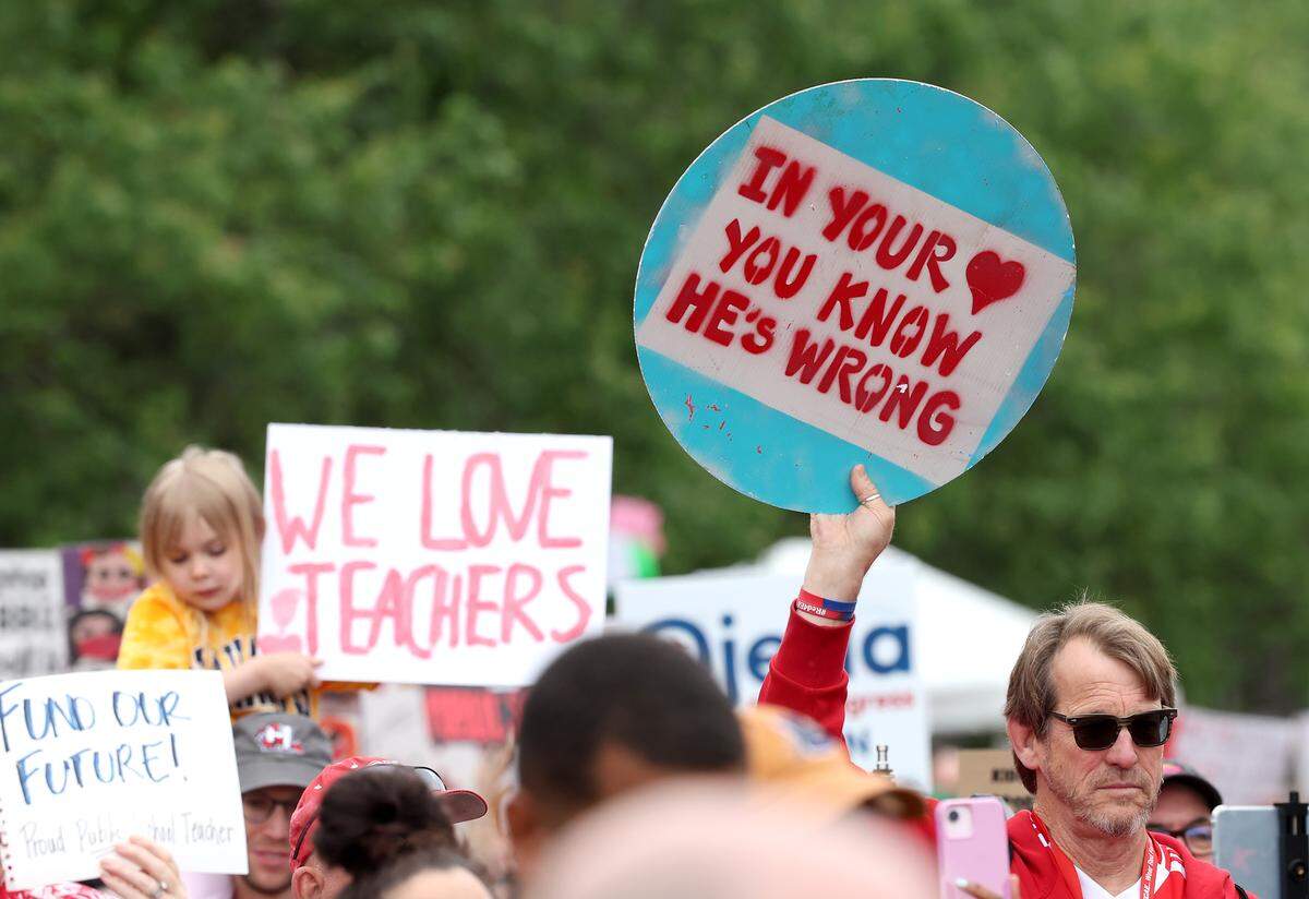 Signs, signs, signs were everywhere as teachers rallied at the Government Complex in Raleigh.