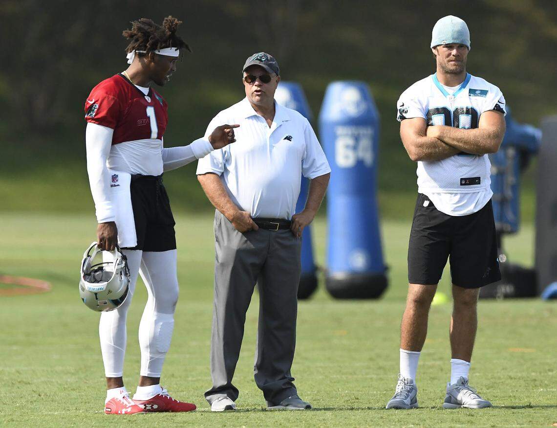 Carolina Panthers quarterback Cam Newton (1) and tight end Greg Olsen (88) talk with team owner David Tepper during training camp at Wofford College in Spartanburg in August.
