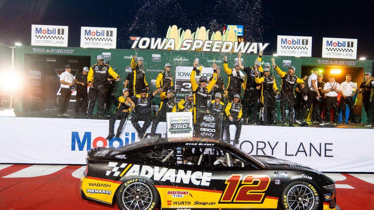 NASCAR Cup Series driver Ryan Blaney (12) and his team celebrate winning the inaugural Iowa Corn 350 on Sunday, June 16, 2024, at Iowa Speedway in Newton.