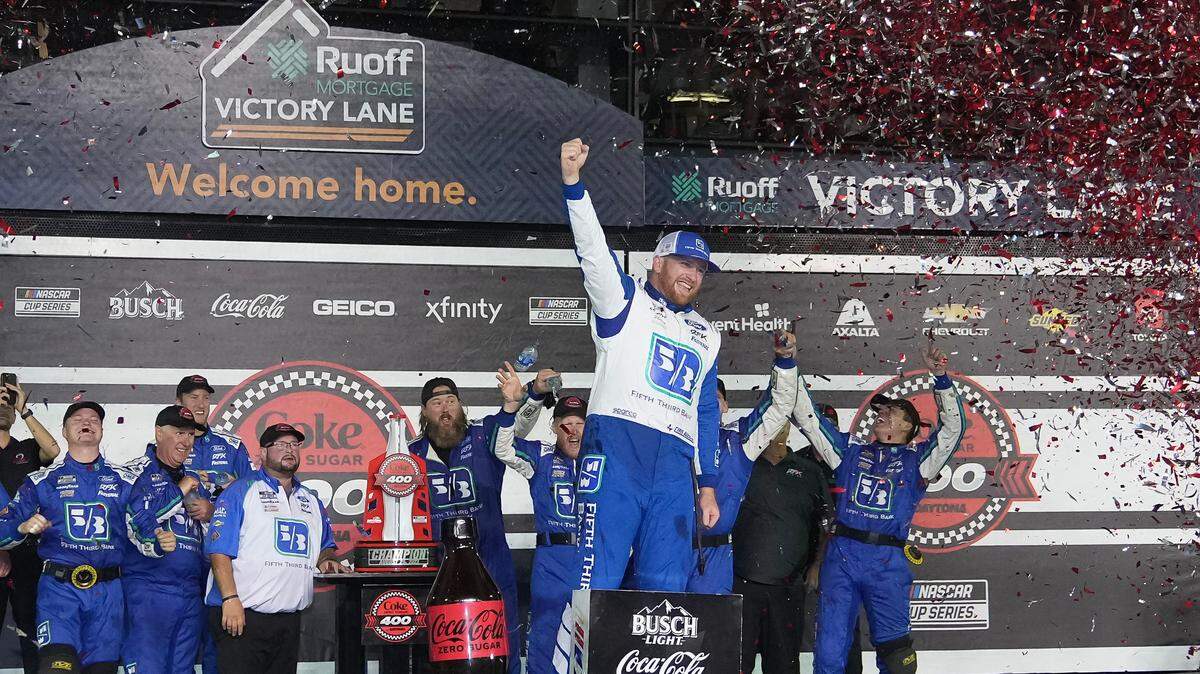 NASCAR Cup Series driver Chris Buescher (17) celebrates in Victory Lane after winning the Coke Zero Sugar 400 at Daytona International Speedway. 