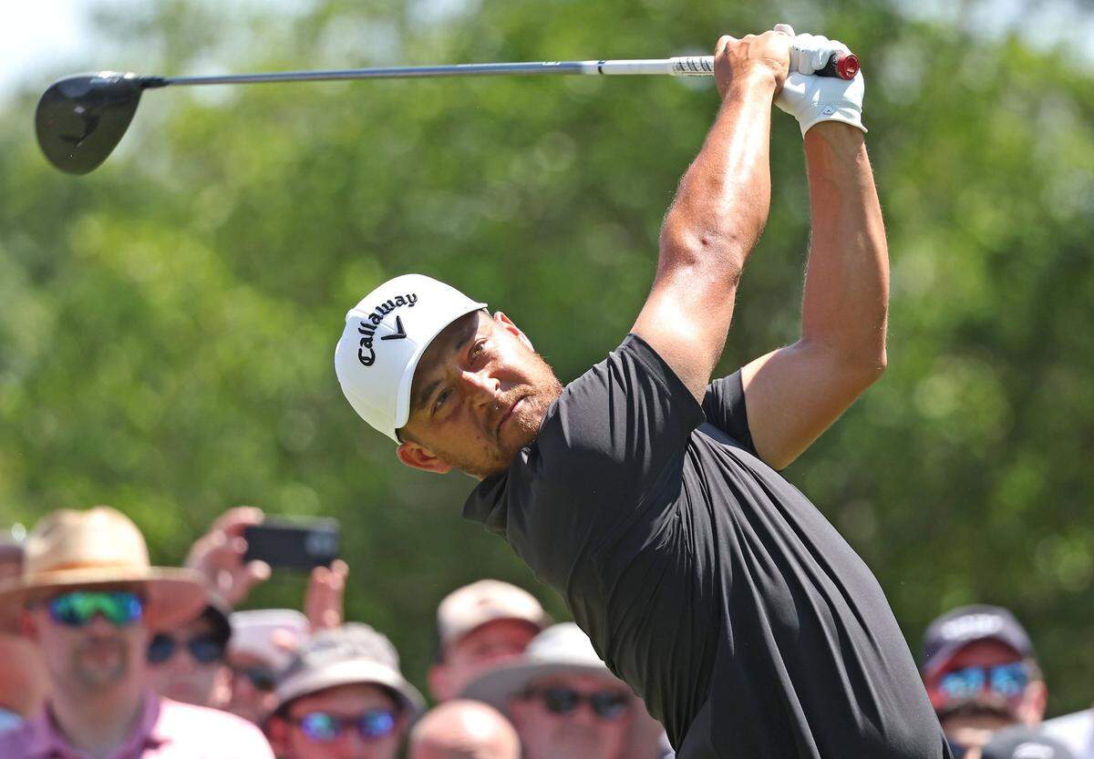 Xander Schauffele watches his drive from the third tee box during the final round of the Wells Fargo Championship at Quail Hollow Club in Charlotte, NC on Sunday, May 12, 2024.