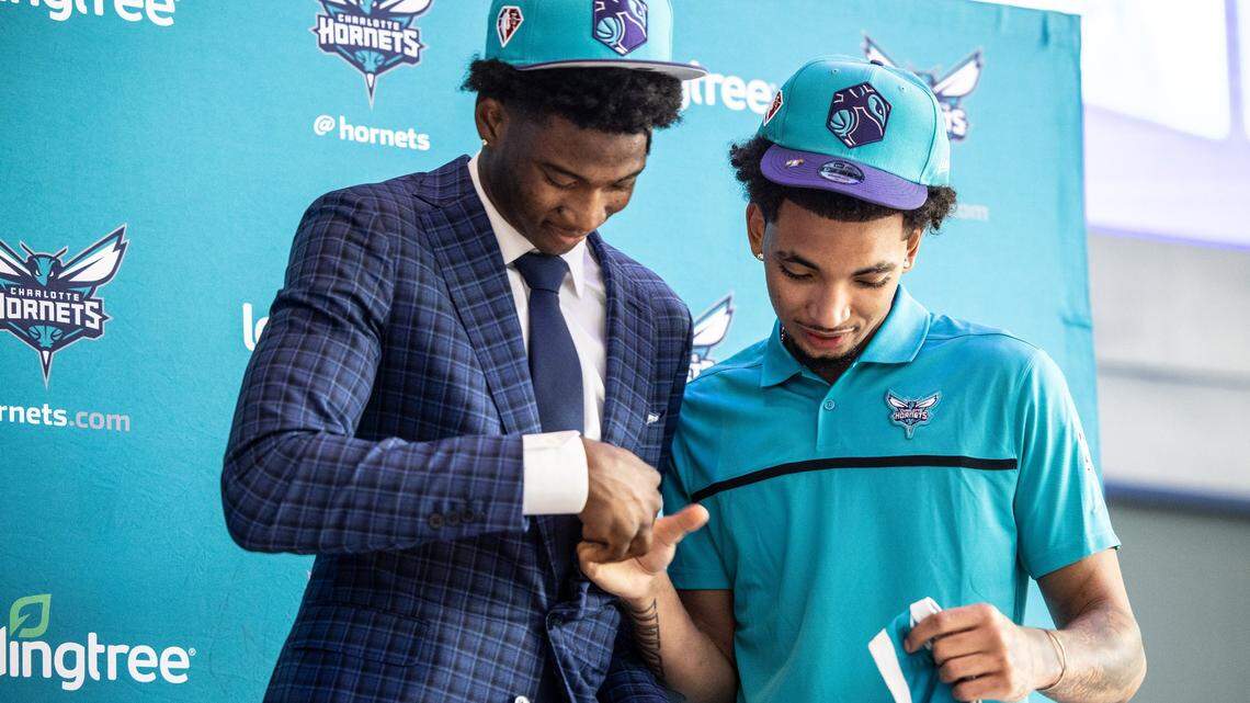 Charlotte Hornets draft picks, Kai Jones, left, and James Bouknight, shake hands during a press conference at the Spectrum Center in Charlotte last July. Bouknight was the Hornets’ lottery pick a season ago.