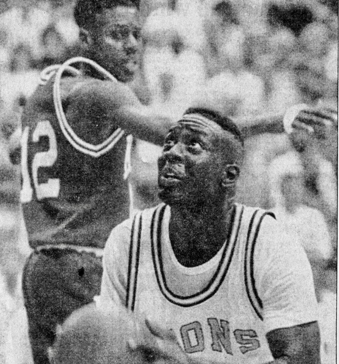 West Charlotte’s Thad Bonaparte attempts a layup in the 1992 state championship game between the Lions and Kinston High School. West Charlotte won its second straight state title.