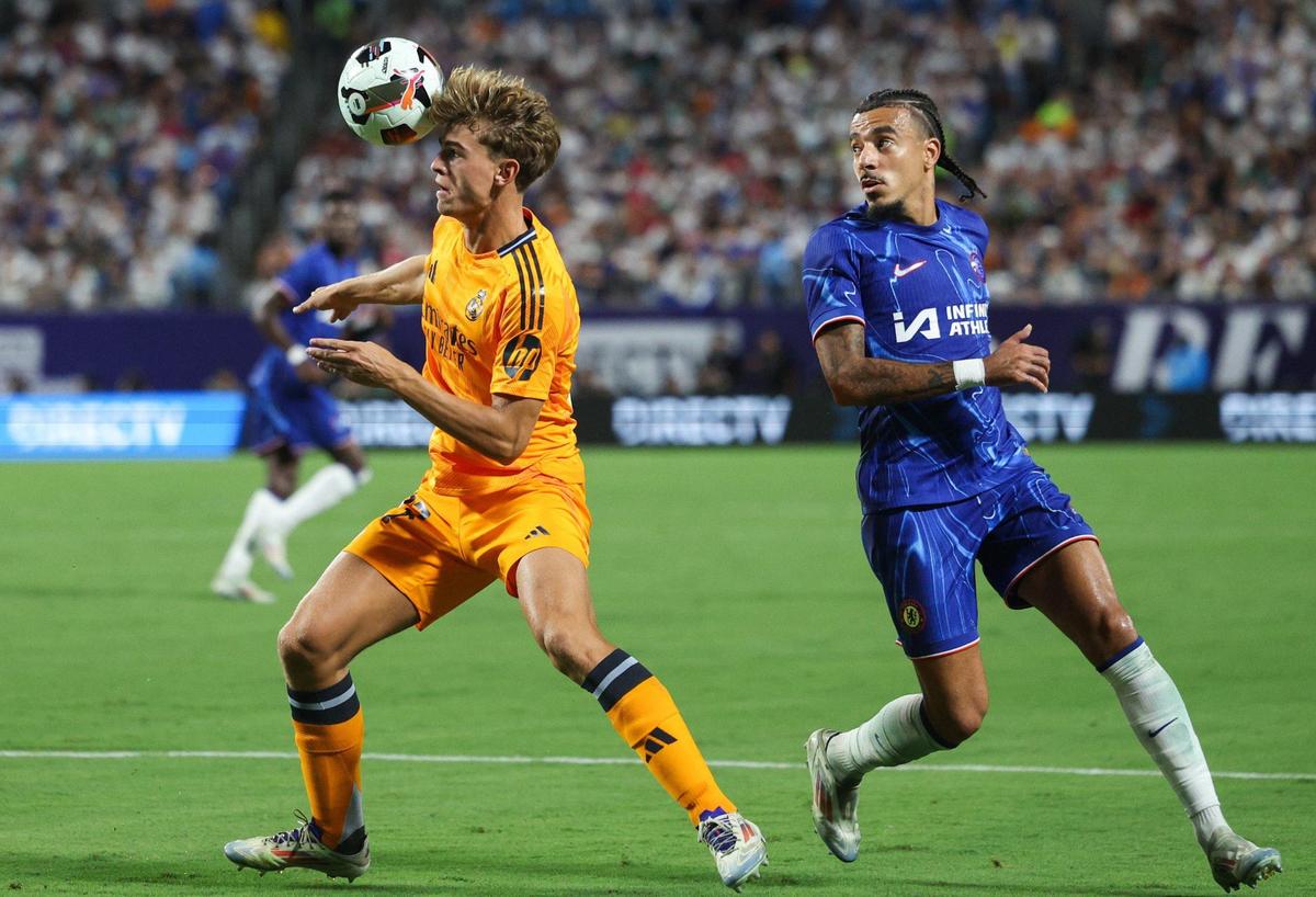 Real Madrid’s Nicolas Paz, left, redirects the ball with a header away from Real Madrid during the match at Bank of America Stadium in Charlotte, NC on Tuesday, August 6, 2024. Madrid bested Chelsea, 2-1.