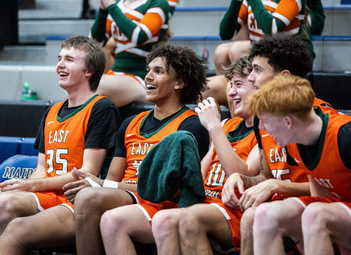 East Lincoln Mustangs bench cheers on their team in the 4th period against the Maiden Blue Devils at Maiden High School in Maiden, N.C., on Monday, January 12, 2025.