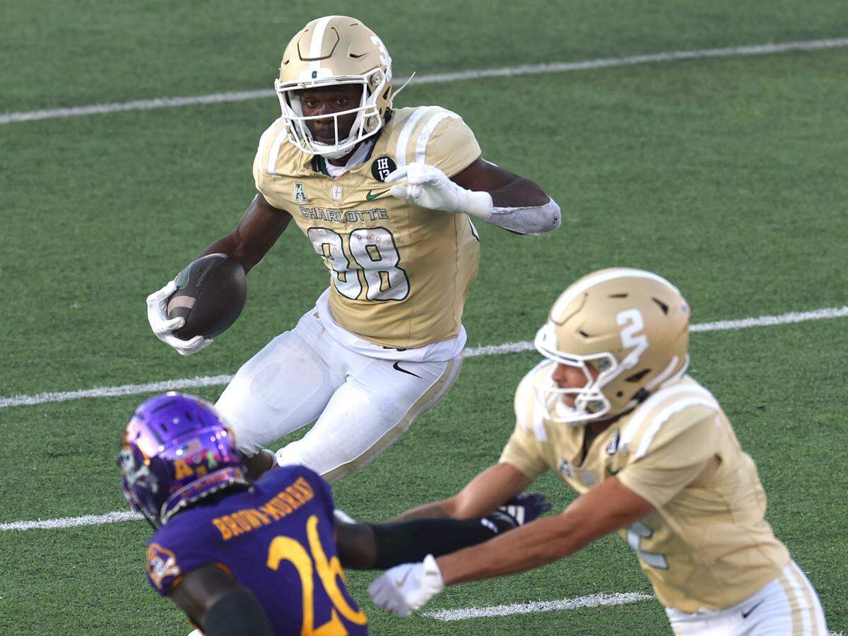 Charlotte 49ers running back Hahsaun Wilson breaks back toward the middle on a run during fourth-quarter action against the East Carolina Pirates on Saturday.