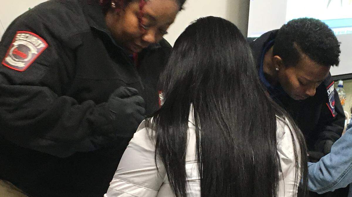 CMS security staff search bags at Rocky River High in this 2019 file photo.