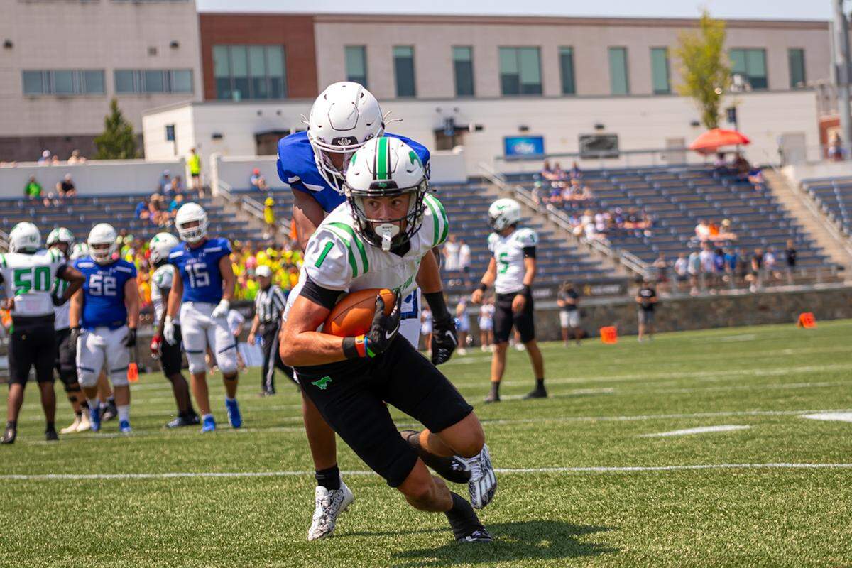 Miles Baucom drives the ball the up the left side past Charlotte Christian opponent