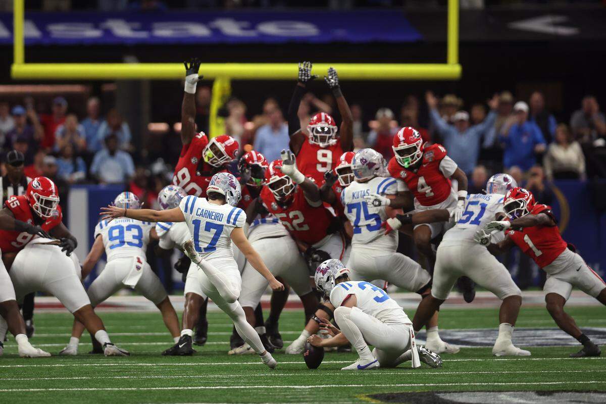 Lucas Carneiro of the Ole Miss Rebels kicks a field goal during the fourth quarter against the Georgia Bulldogs during the 2025 College Football Playoff quarterfinal at the Allstate Sugar Bowl at Caesars Superdome on Jan.  1, 2026. in New Orleans, Louisiana. 