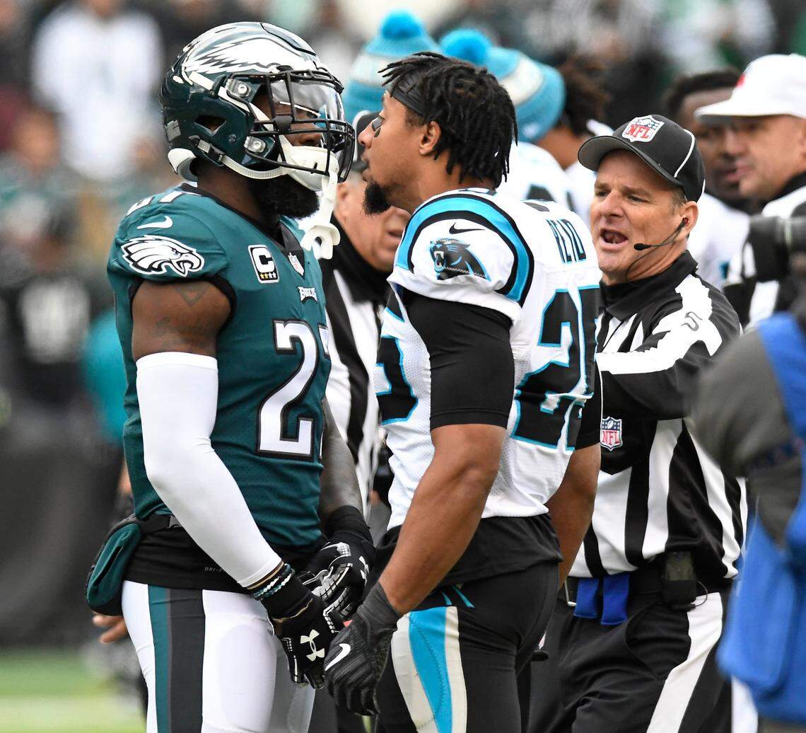 Carolina Panthers strong safety Eric Reid (25) has words for Philadelphia Eagles strong safety Malcolm Jenkins (27) before Sunday’s game in Philadelphia.  Afterward, Reid said Jenkins has sold out NFL players’ efforts for social justice.