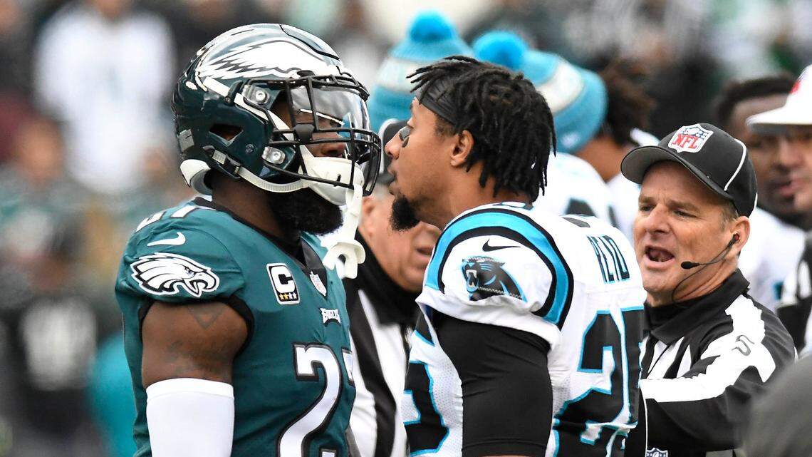 Carolina Panthers strong safety Eric Reid (25) has words for Philadelphia Eagles strong safety Malcolm Jenkins (27) before Sunday’s game in Philadelphia.  Afterward, Reid said Jenkins has sold out NFL players’ efforts for social justice.