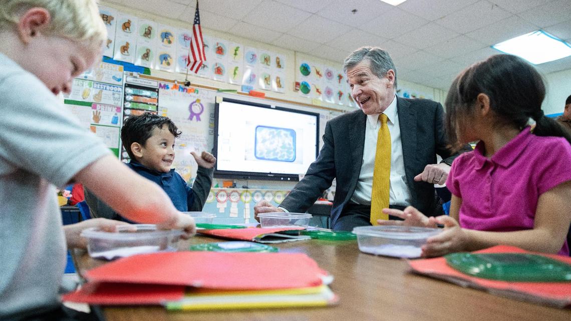 Gov. Roy Cooper visits with students as he tours Huntingtowne Farms Elementary School in Charlotte, N.C., on Wednesday, May 24, 2023.