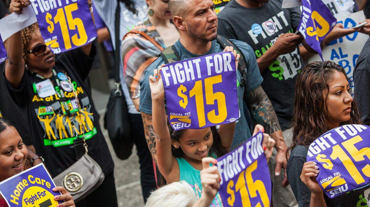 Workers rally for a minimum wage hike in Los Angeles in 2105. North Carolina approved a $15 minimum wage for state workers but not for private sector workers.