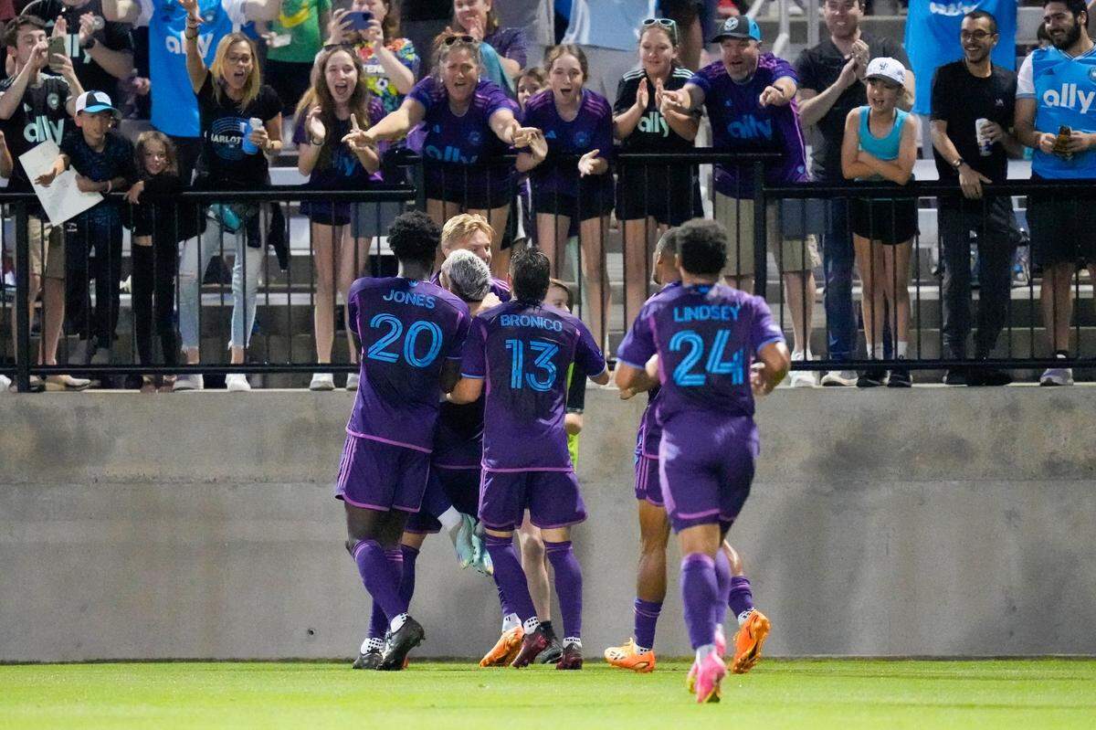 Charlotte FC midfielder Kamil Jozwiak (7) celebrates his goal with his teammates against the Orlando City during the second half at Mecklenburg County Sportsplex.