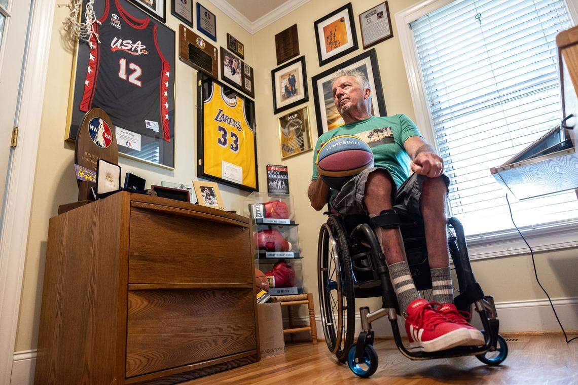 Paralympian gold medalist David Kiley poses for a portrait in Mooresville, N.C., in his home office. His USA team jersey other sports memorabilia is displayed on the walls.