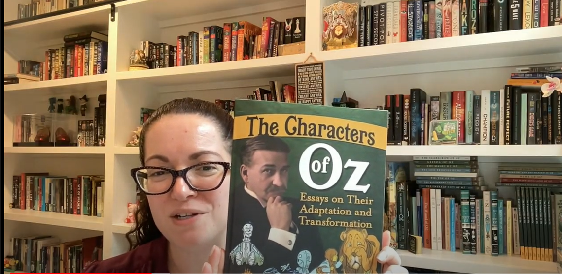 During an Aug. 8, 2024, Google Meet interview with The Charlotte Observer, Dina Massachi holds one of her two published books about “The Wizard of Oz.”