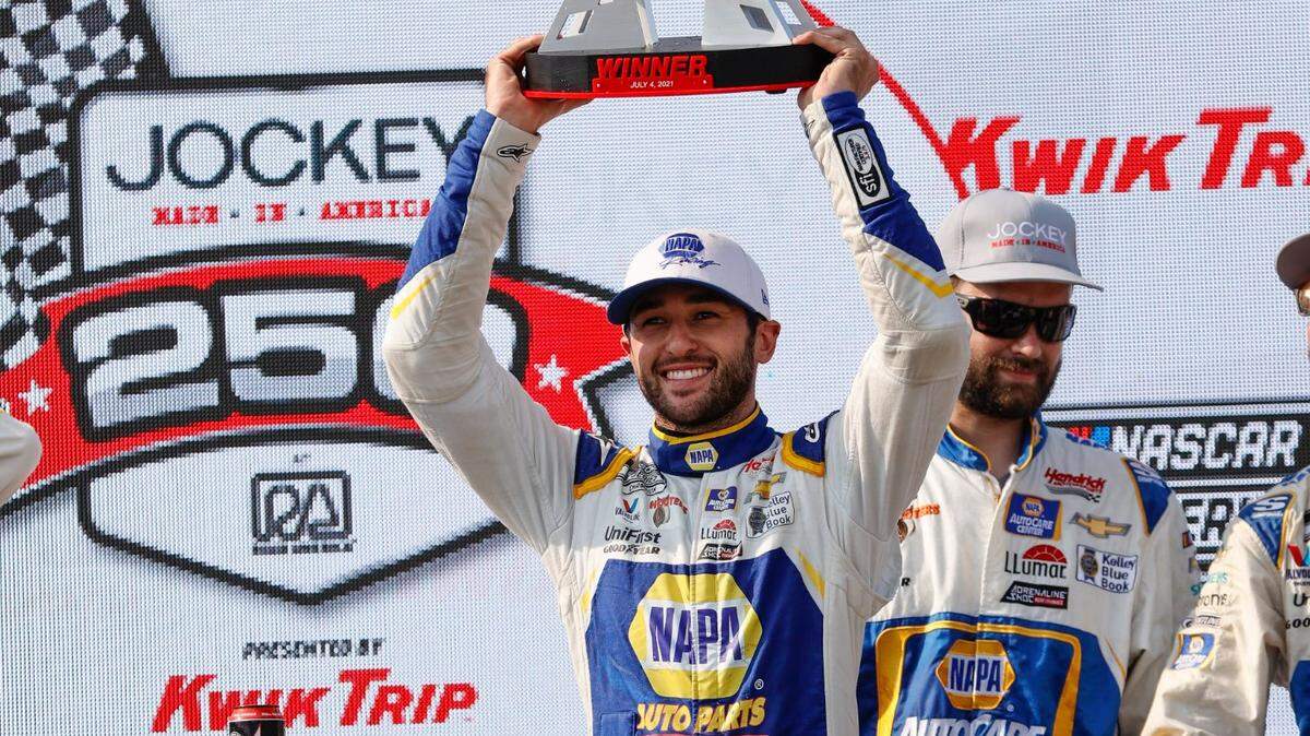 Chase Elliott (9) holds up his trophy after winning a NASCAR Cup Series auto race Sunday, July 4, 2021, at Road America in Elkhart Lake, Wis. (AP Photo/Jeffrey Phelps)