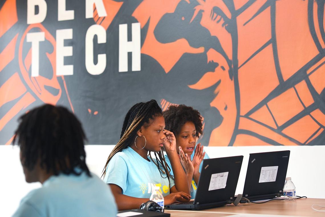 Kyla Hurdle, 13, (left) and Jaila Woodruff, 11, work on a project at the INTech technology camp.