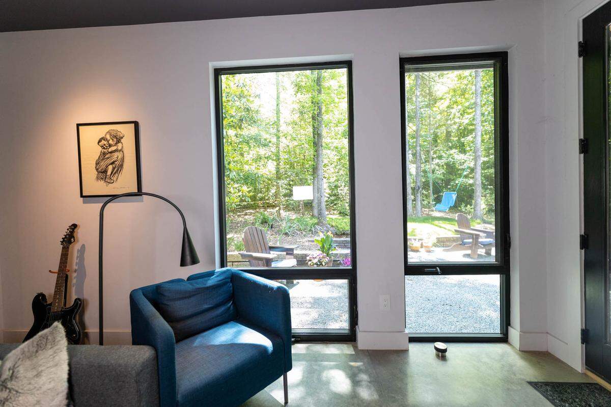 Large windows in living room offer a patio view.