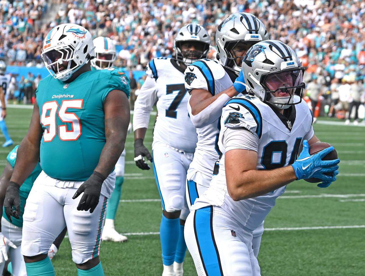 Carolina Panthers tight end Mitchell Evans, right, celebrates his touchdown pass reception during fourth quarter action against the Miami Dolphins on Sunday, October 5, 2025 at Bank of America Stadium in Charlotte, NC. The Panthers defeated the Dolphins 27-24.