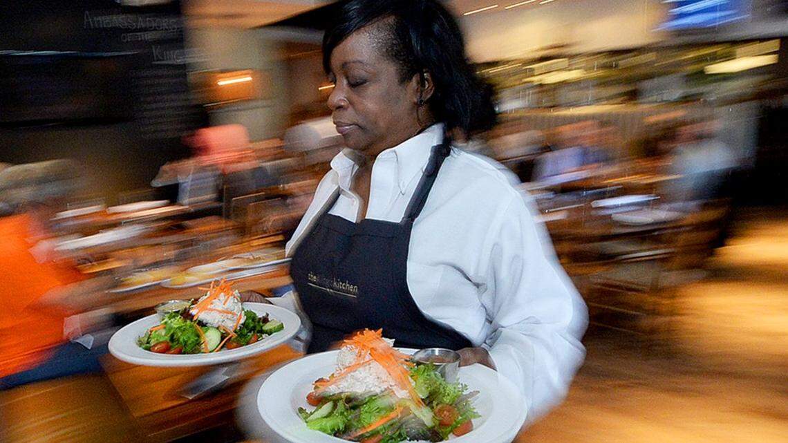Waitress Angela Jones serves customers during a busy lunchtime at King’s Kitchen in uptown. Will making Charlotte a destination for dining translate to more jobs and a better food economy? Diedra Laird