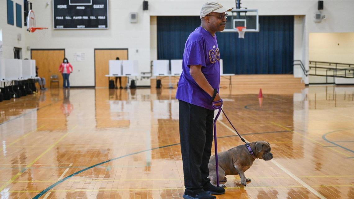 “I always bring him with me to vote. He goes everywhere I go,” explains Oral Chadwick, 62, about why he brought his American bully dog, Marcus, with him to precinct 230 in west Charlotte for the 2023 City Council primary on Tuesday, September 12, 2023 at Berewick Recreational Center.