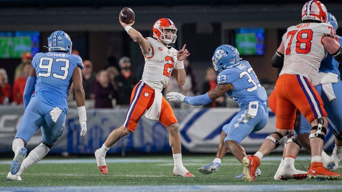 Clemson quarterback Cade Klubnik (2) looks for a receiver in the the quarter as he is pressured by North Carolina’s Cedric Gray (33) during the ACC Championship game on Saturday, December 3, 2022 at Bank of American Stadium in Charlotte, N.C. Klubnik passed for 279 yards and one touchdown.