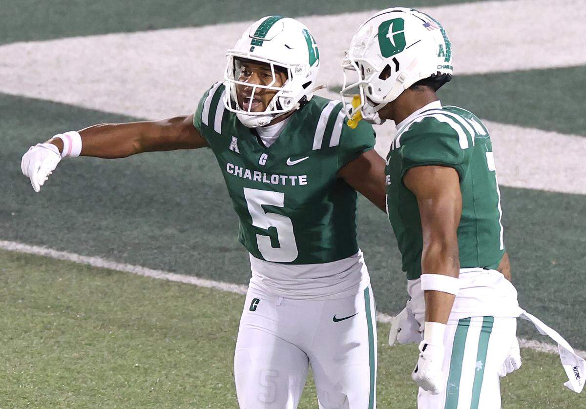 Charlotte 49ers wide receiver Javen Nicholas, left, celebrates his touchdown pass reception from quarterback Grayson Loftis during action against North Texas on Friday, October 24, 2025 at Jerry Richardson Stadium.