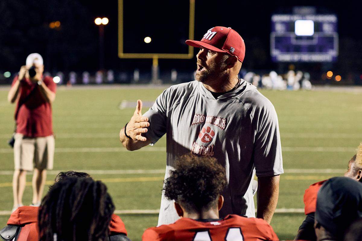 South Meck coach Joe Evans addresses his players following a win over East Meck.