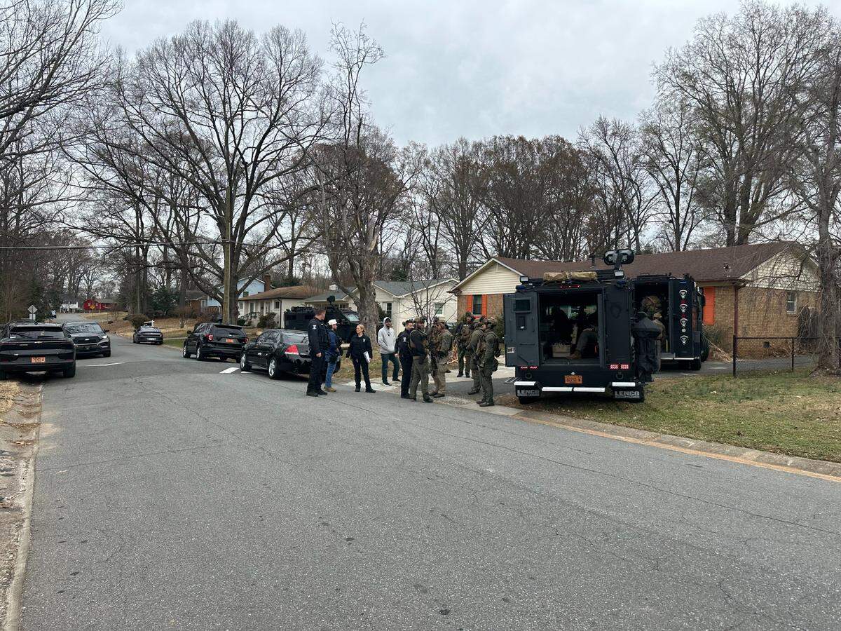 Charlotte police on scene in Windsor Park on Wednesday, Dec. 17, after officers in military gear took a person into custody.