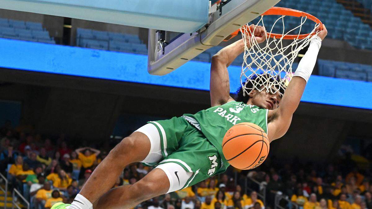 Myers Park’s Bishop Boswell throws down a two-handed dunk at the NCHSAA state 4A championship game in March.