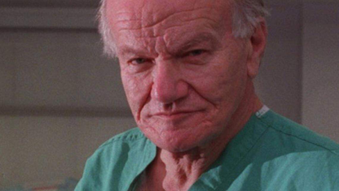 Dr. Francis Robicsek retired in 1998 after years as a leading heart surgeon. Here, he is shown in an operating room at Carolinas Medical Center at the time. (TODD SUMLIN/STAFF)