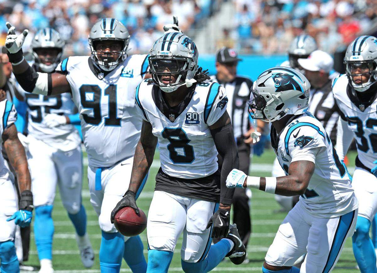 Carolina Panthers cornerback Jaycee Horn, center, and his teammates celebrate his interception of a pass by Los Angeles Chargers quarterback Justin Herbert during action on Sunday, September 15, 2024 at Bank of America Stadium in Charlotte, NC.