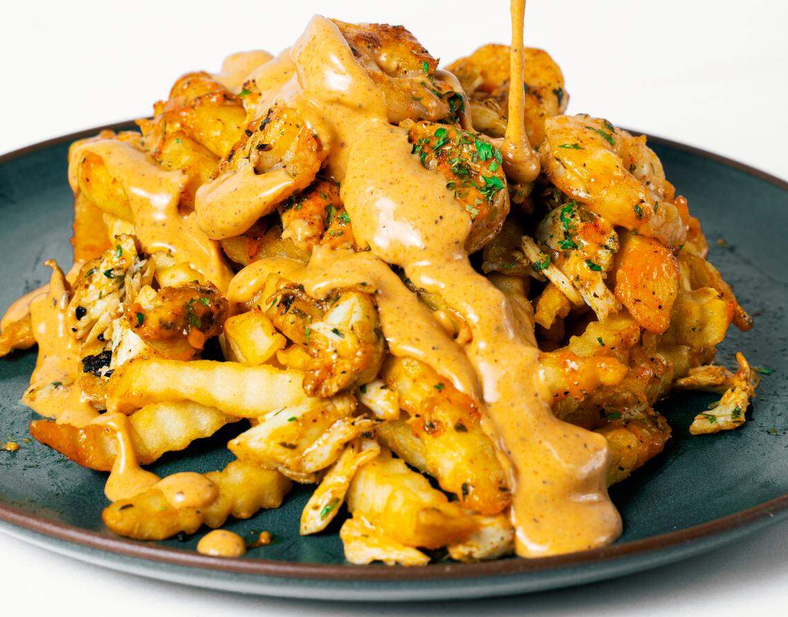 Lulu’s crab fries, topped with shrimp.