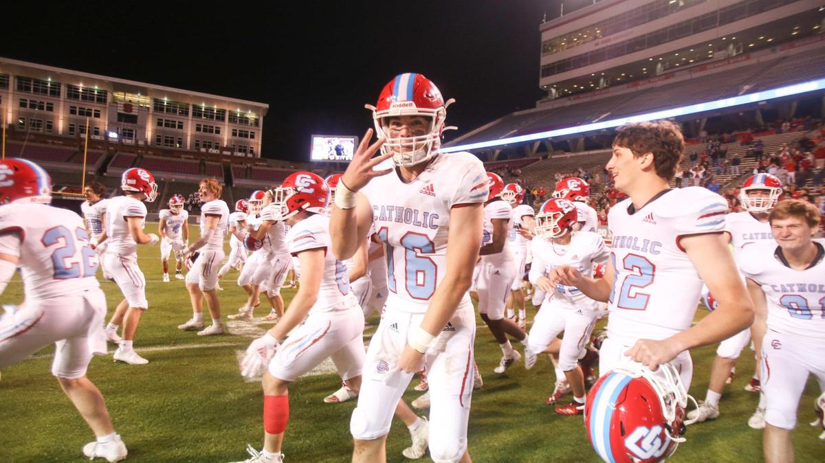 Charlotte Catholic quarterback Sean Boyle (16) and the team celebrate their fourth state championship as time expires during the NCHSAA 3A State Championship football game between Charlotte Catholic and Havelock in Raleigh on Friday, May 7, 2021. Charlotte Catholic won the championship game 14-7.