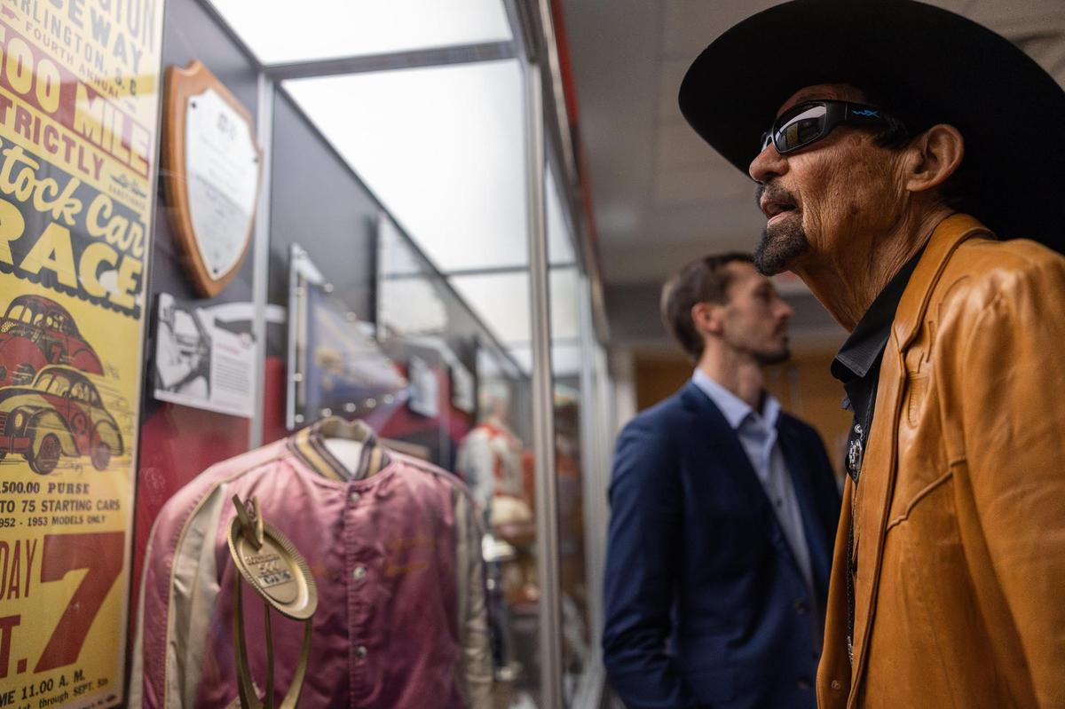 NASCAR Hall of Famer Richard Petty looks at the Darlington Raceway 75th Anniversary Exhibit at the NASCAR Hall of Fame Charlotte, N.C., on Tuesday, March 18, 2025.