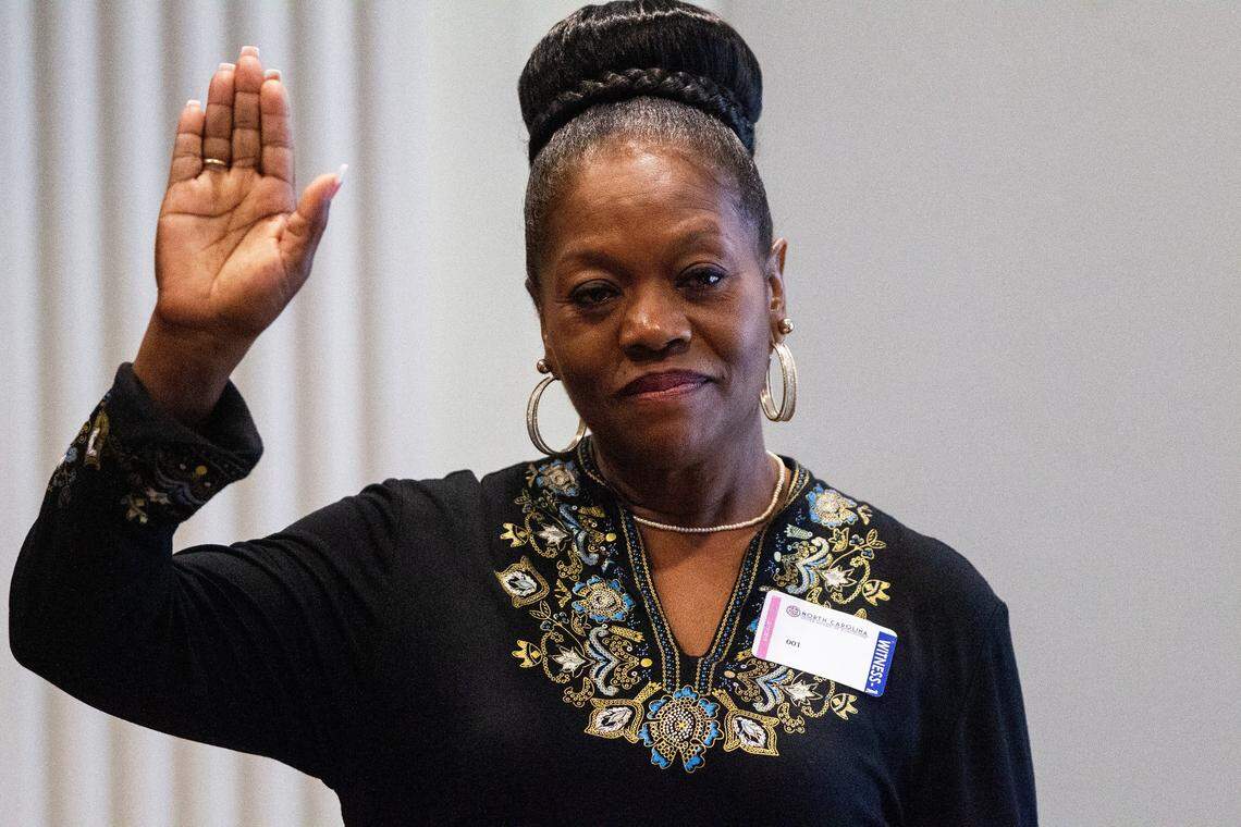 Agnes Willis, a Bladen County poll worker, prepares to testify under oath during the second day of a public evidentiary hearing on the 9th Congressional District voting irregularities investigation Tuesday, Feb. 19, 2019, at the North Carolina State Bar in Raleigh.
