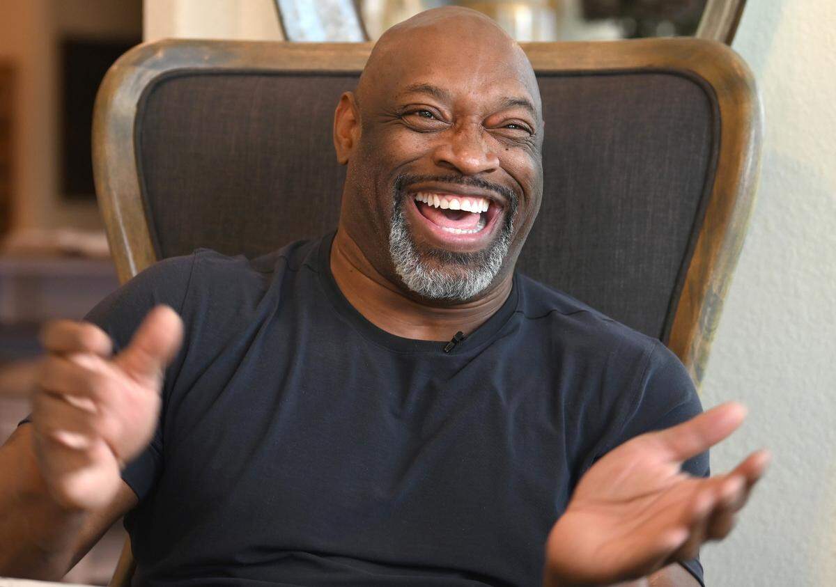 Former NFL linebacker Lamar Lathon laughs as he discusses his career on Friday, November 18, 2022 at his home outside of Houston, TX. Lathon was drafted by the Houston Oilers in 1990. Lathon played with the Carolina Panthers from 1995 until 1998. He made the Pro Bowl in 1996.