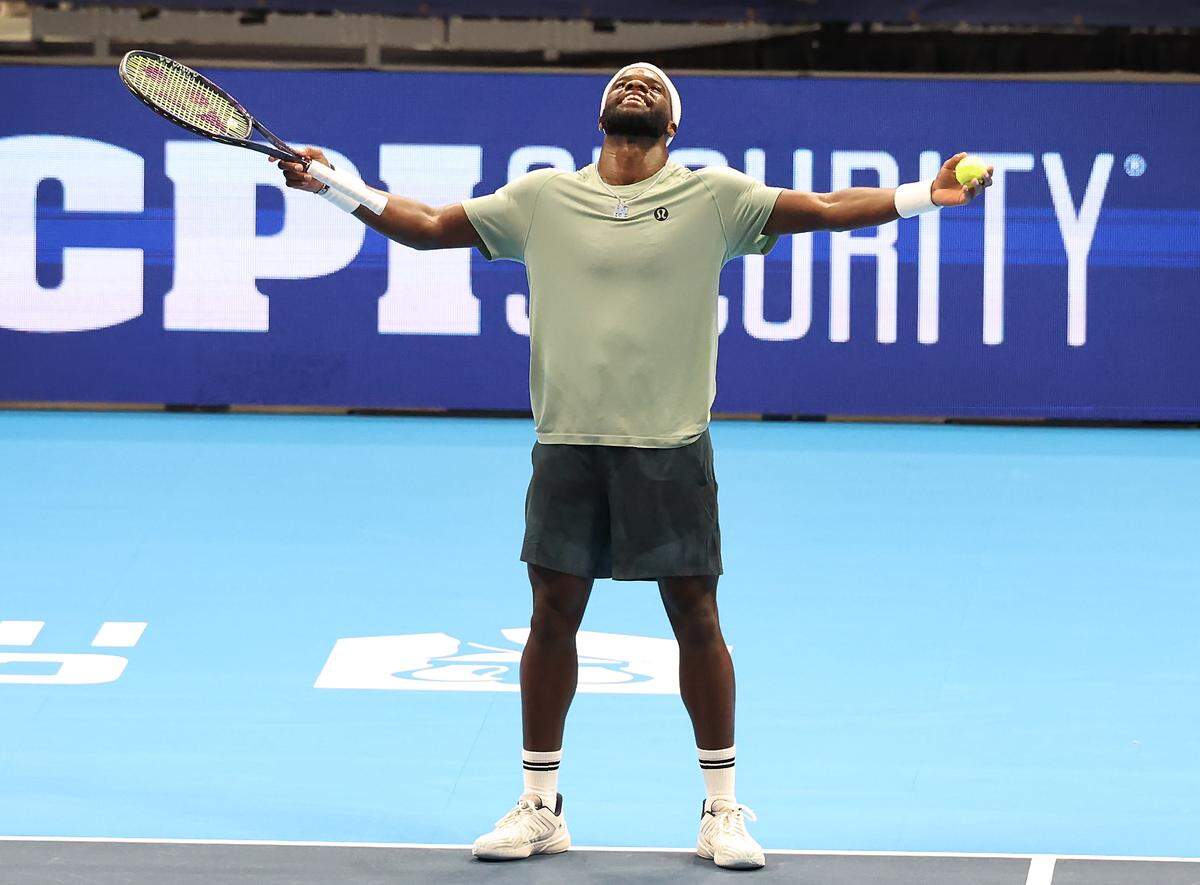 Frances Tiafoe celebrates his victory over Taylor Fritz in the Charlotte Invitational on Thursday.