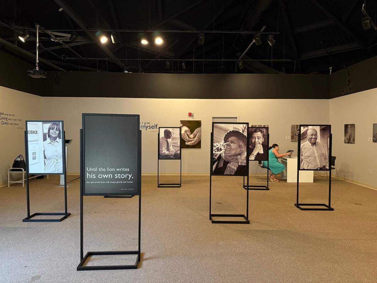 One section of “Giving Back: The Soul of Philanthropy Reframed and Exhibited,” picturing Black philanthropists, Tuesday, July 15, 2025. On the back of the photos are their stories.