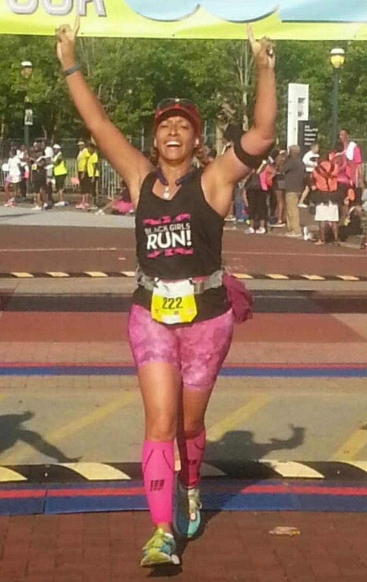 Dawn Calhoun finishes Black Girls RUN!’s Sweat With Your Soles race in Atlanta in 2014.