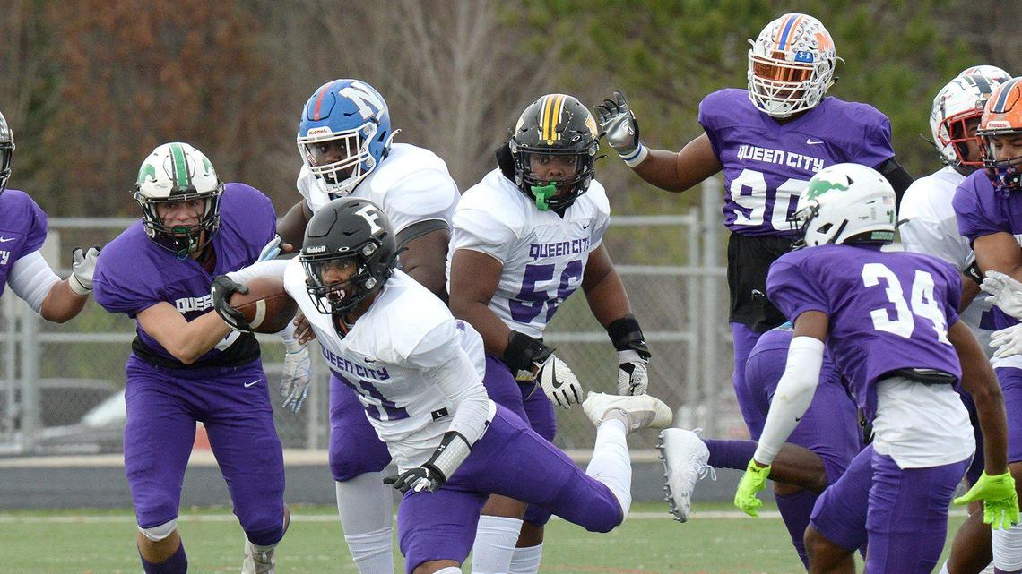 Forestview’s, #21, Camury Reid carries the ball for the West squad in the first half of the Queen City Senior Bowl. The West squad took a 27-3 lead into halftime at the Queen City Senior Bowl. Split between East and West teams about 80 high school football stars from almost 60 schools across the Charlotte region squared off in the Queen City Senior Bowl on Saturday, Dec. 18, 2021 at Olympic High School.