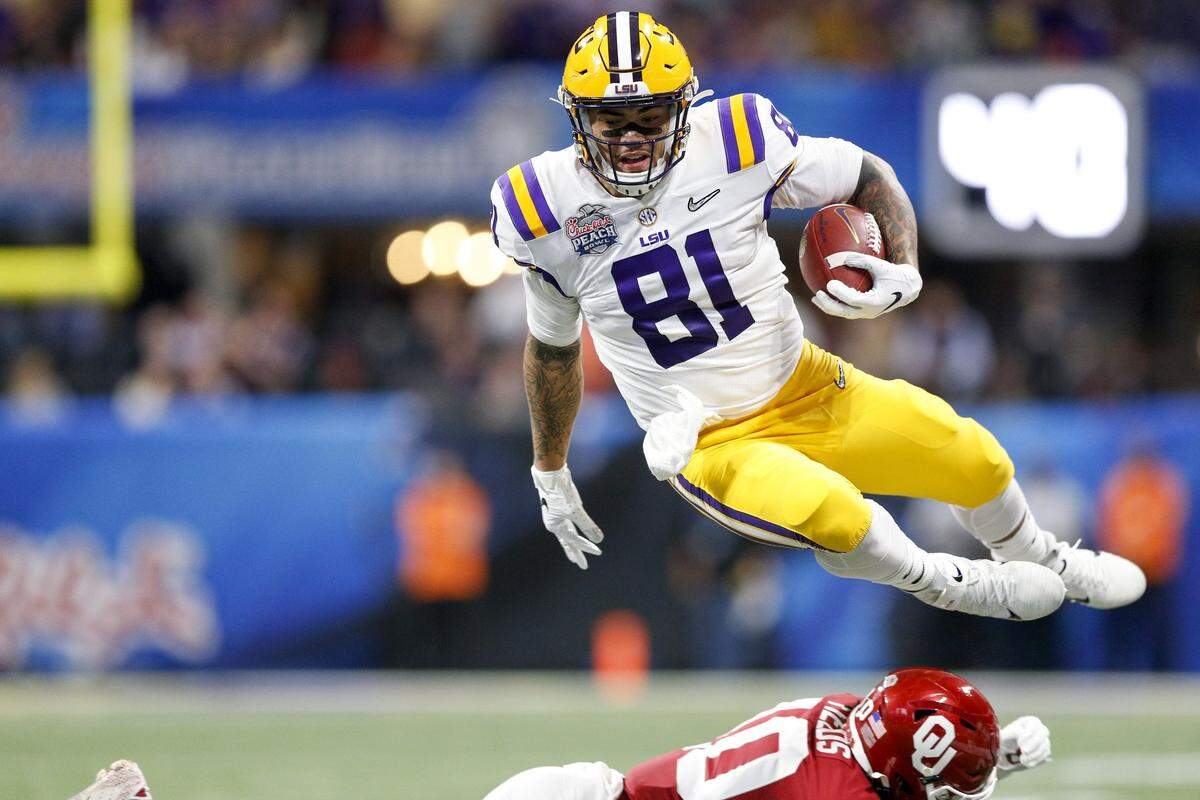 LSU tight end Thaddeus Moss (81) hurdles Oklahoma safety Pat Fields (10) during the first half of the Peach Bowl NCAA college football playoff semifinal in Atlanta on Saturday, Dec. 28, 2019. (Ian Maule/Tulsa World via AP)