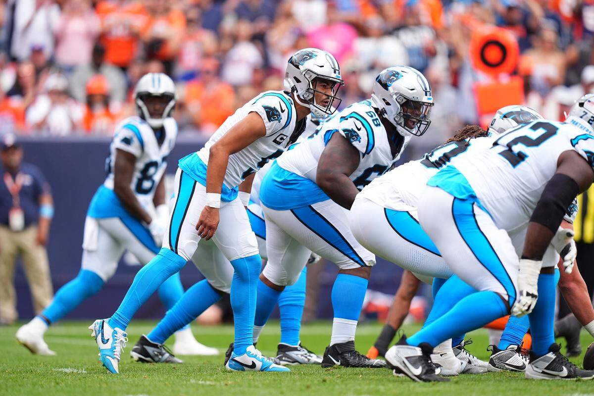 Carolina Panthers quarterback Bryce Young (9) at the line of scrimmage in Sunday’s first half against the Denver Broncos at Empower Field at Mile High.
