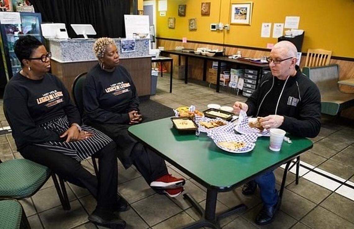 Sisters Deborah Currence and Cheryl Littlejohn speak with chef Robert Irvine before filming “Restaurant Impossible.”