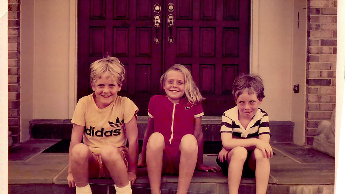 Mike Kerrigan, left, and his siblings, Brigid and Jack, wait on the porch in the 80s hoping for a few friends to stop by so they can take a pyramid photo.