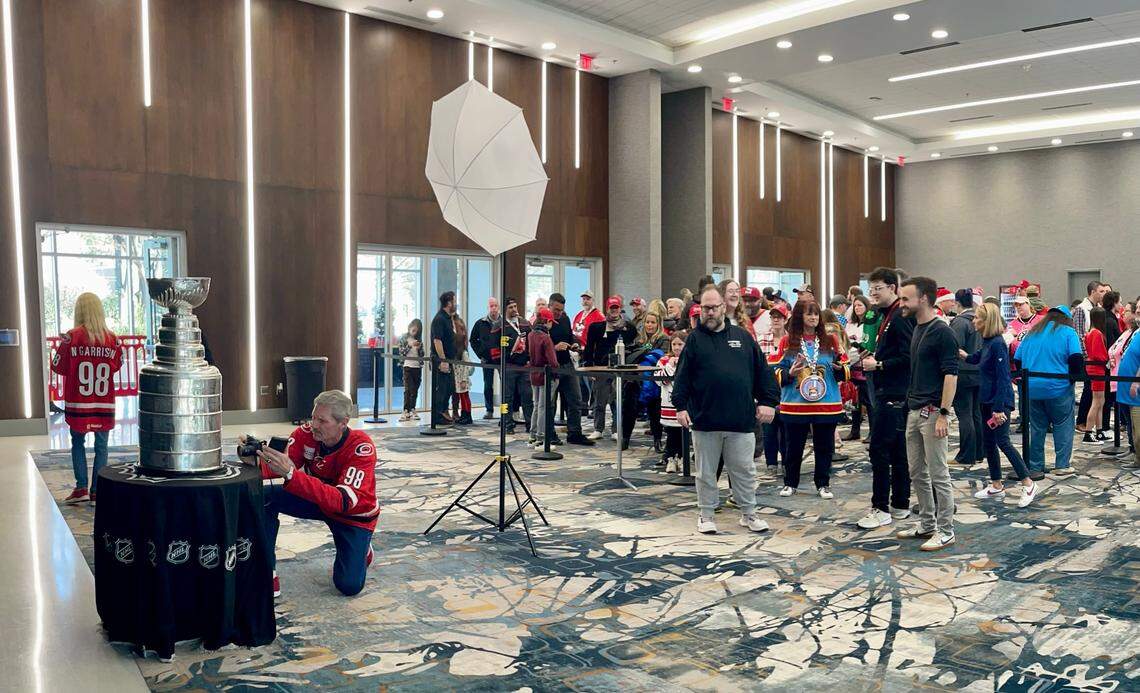 Hundreds of hockey fans gather in Bojangles Coliseum to get their chance to take a picture with the Stanley Cup on Saturday, Dec. 21, 2024 before the Charlotte Checkers game.