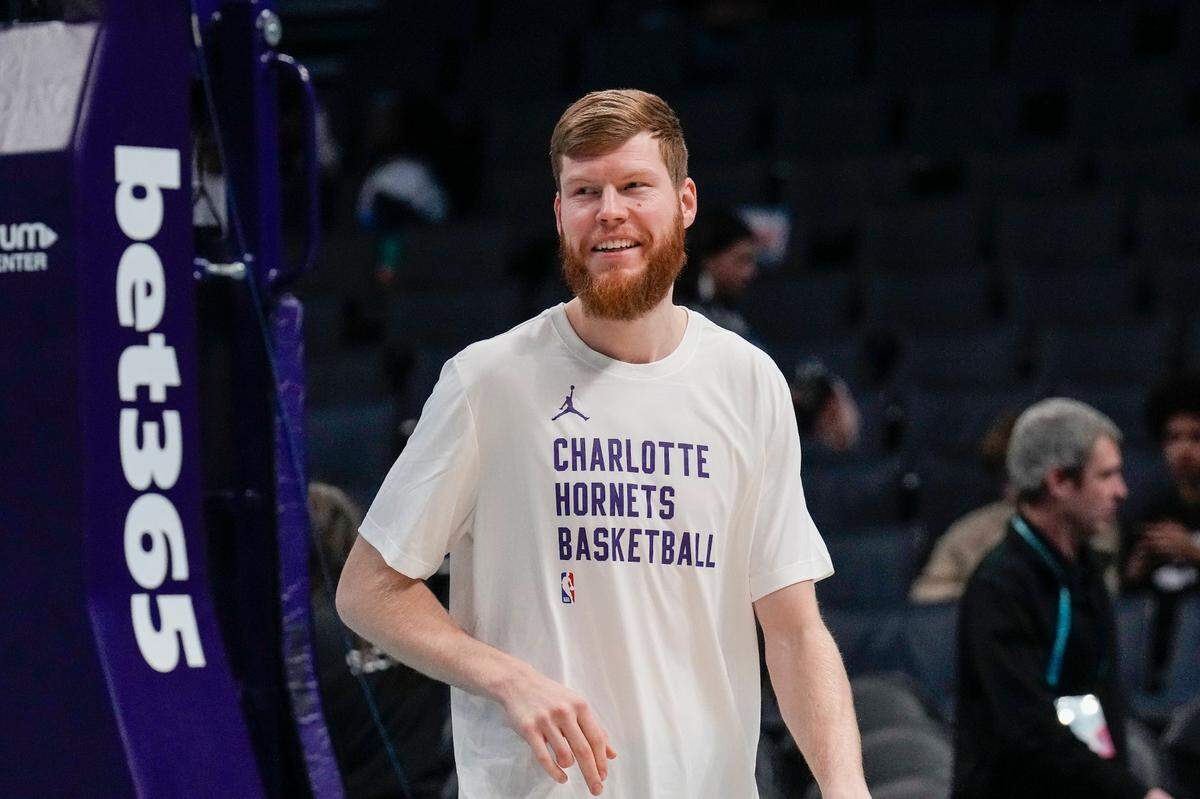Feb 10, 2024; Charlotte, North Carolina, USA; Charlotte Hornets forward Davis Bertans (9) during the pregame warmups against the Memphis Grizzlies at Spectrum Center.